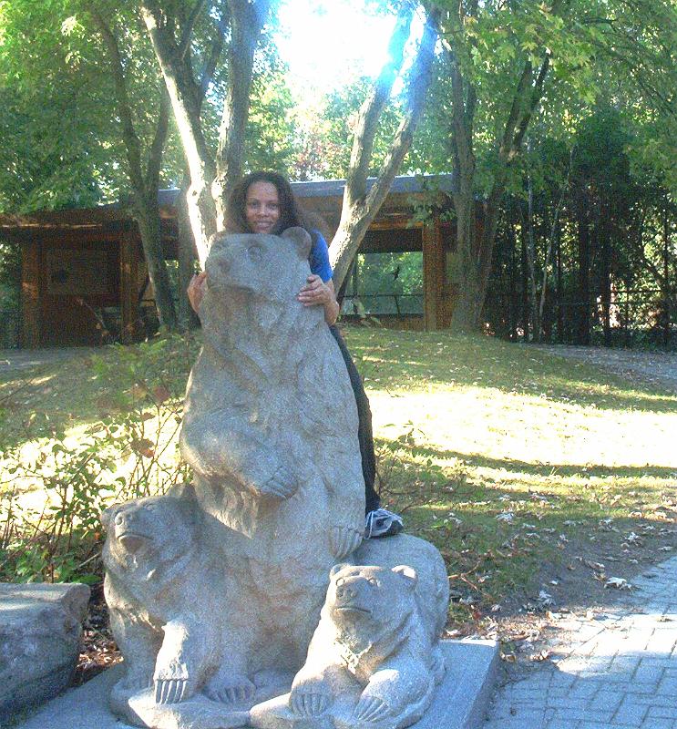 cheena on statue(2).jpg - Cheena and a bear at Toronto Zoo